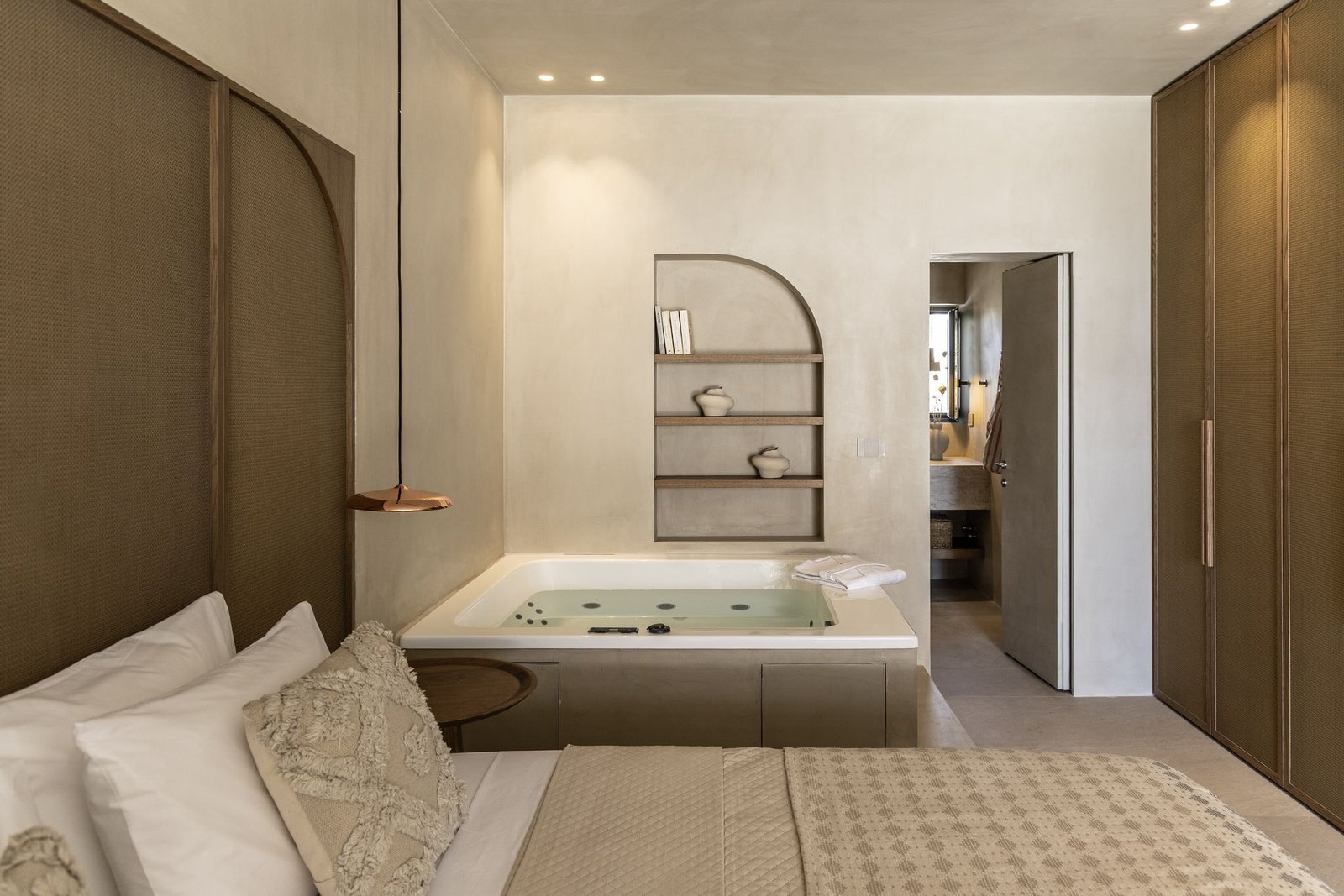 Althea Suite with indoor jacuzzi beside the bed