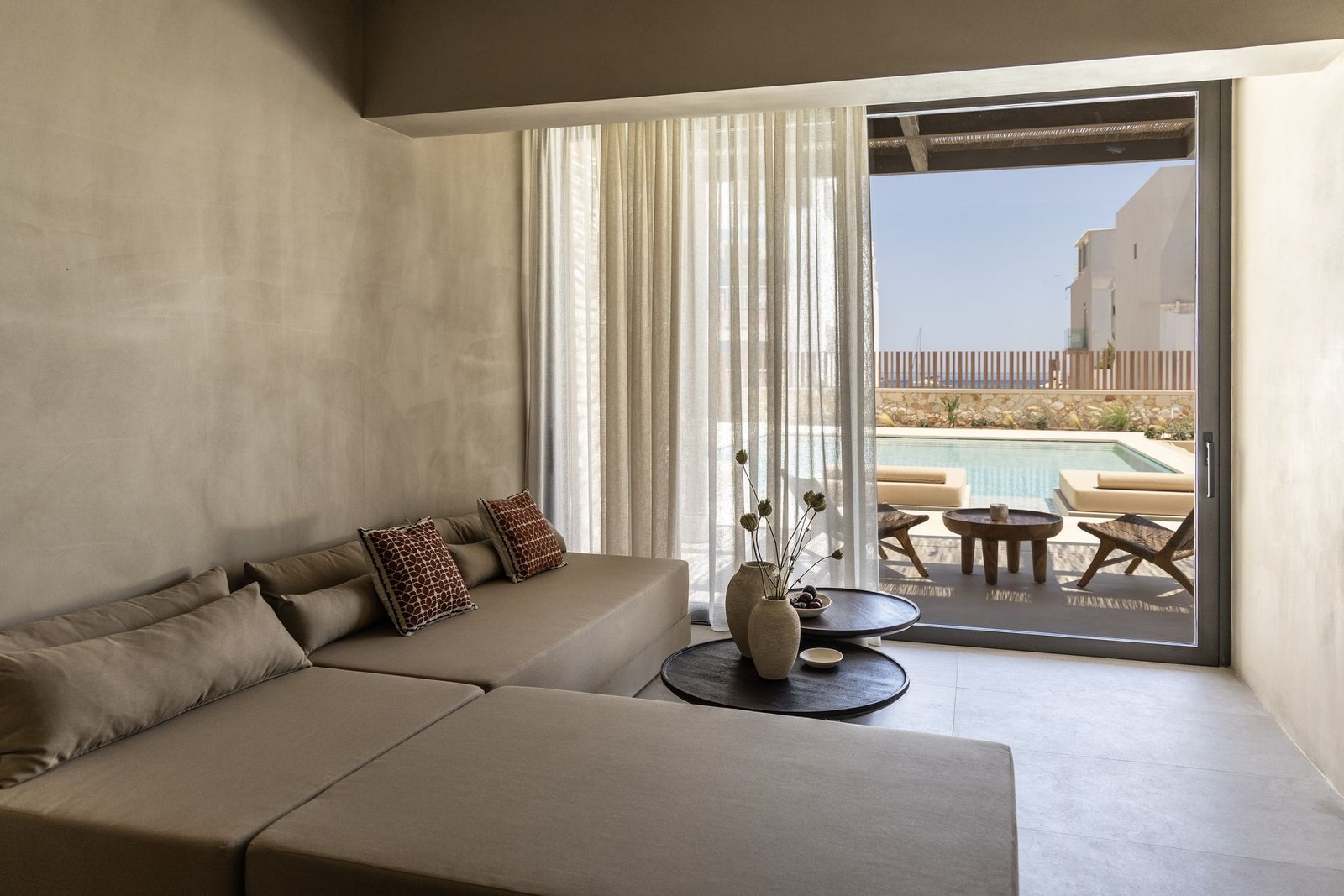 Aurelia Suite living area opening to the pool terrace