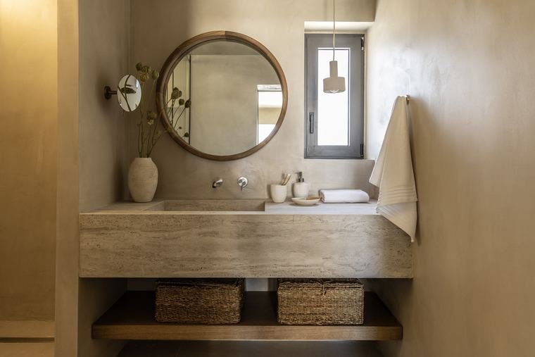 Travertine vanity and round mirror