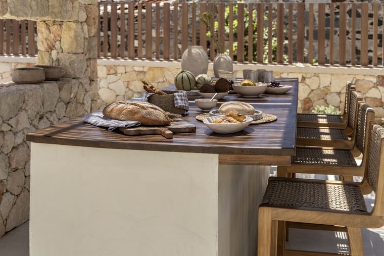 The long dining table set for dinner